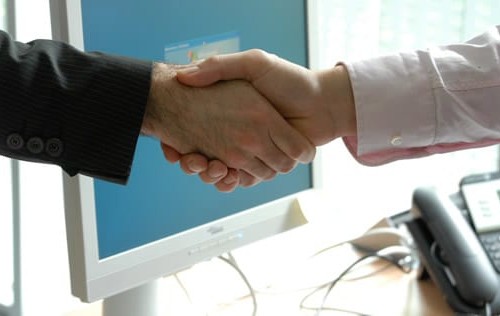 To people shaking hands on a deal